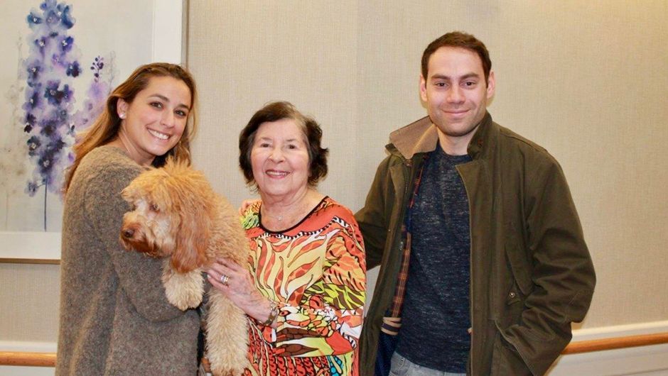 Memory care resident and family with dog